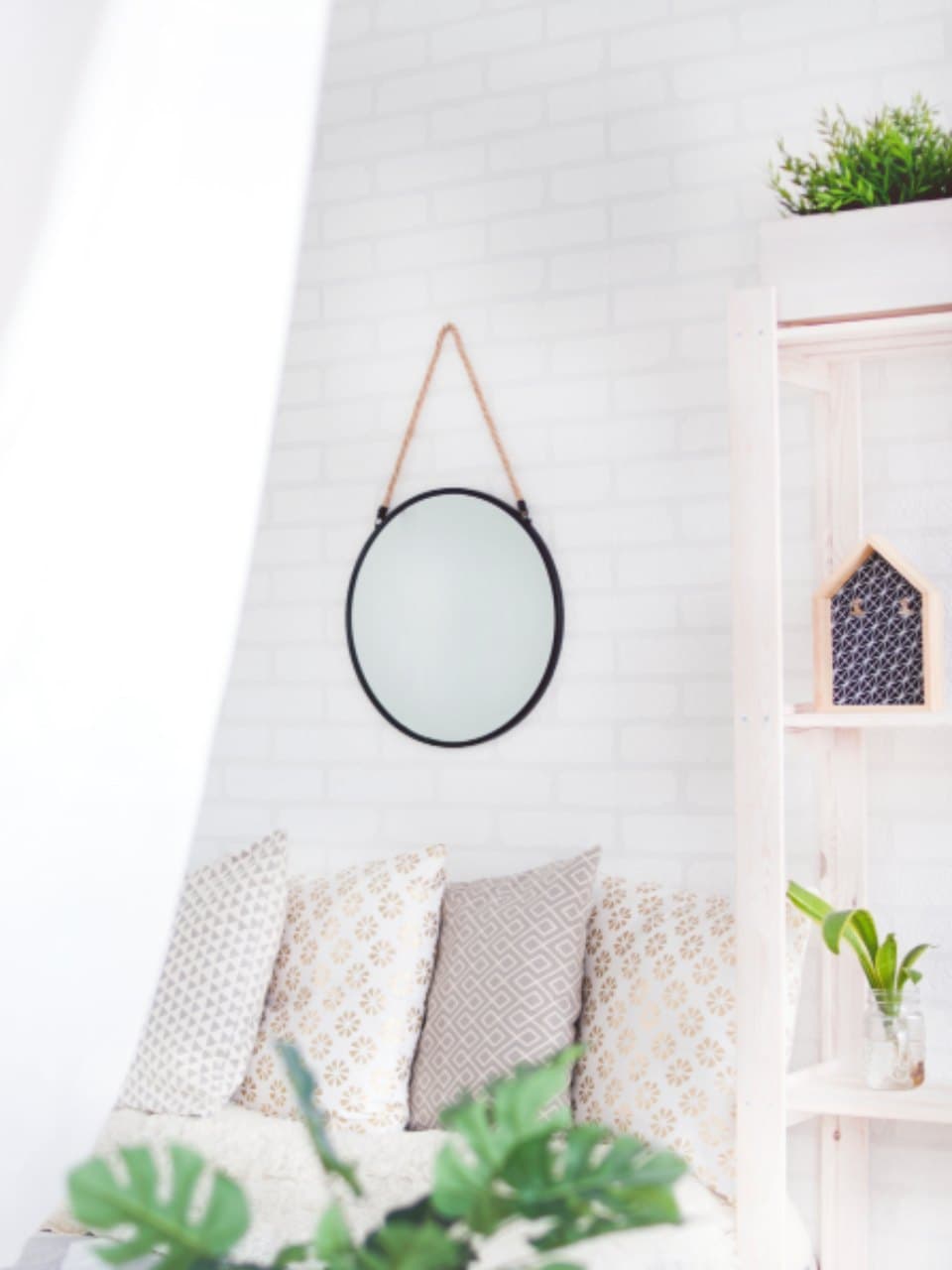 Contemporary interior with a round wall mirror